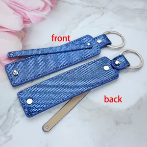 Blue sequin keychain charm with metal ring shown from front and back perspectives