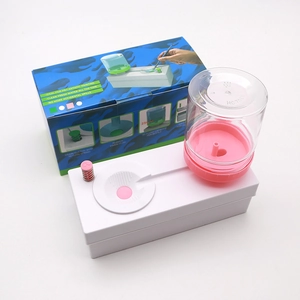 Automatic brush rinser with pink base and 250ml water bottle in original packaging