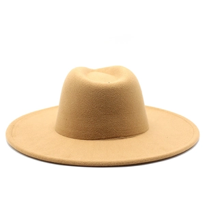 Front view of a classic camel wool fedora hat with wide flat brim and indented crown