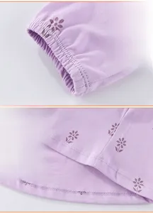 Detail of lavender floral girls dress featuring elastic cuffs and double-stitched hemline