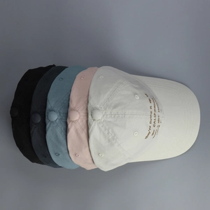 Detail view of five colors of washed cotton baseball caps with California embroidery