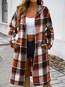 Close-up of oversized plaid hooded coat featuring a button-down front and autumn patterns
