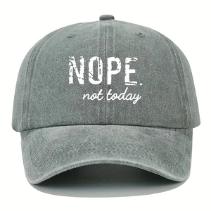 Macro detail of 'NOPE. not today' print on washed gray vintage cotton baseball cap