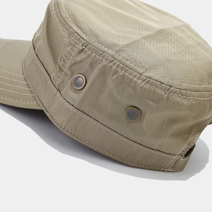 Close-up of khaki flat top cap with ripstop texture and metal breathable eyelets