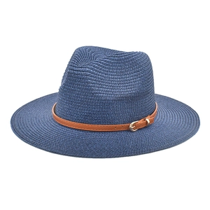 Detailed close-up of dark blue woven straw hat with brown leather belt and golden buckle