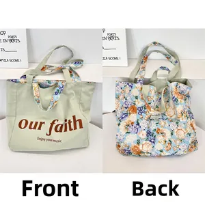 Detail of reversible canvas tote bag showing green print side and floral pattern reverse