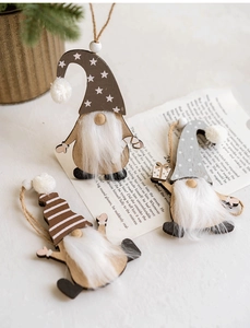 Close-up of Nordic wooden Christmas gnome ornaments with faux fur and festive patterns