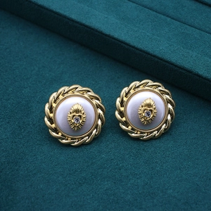 Vintage gold weave stud earrings with pearl center and rhinestone heart accent