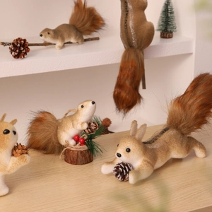 Detail of furry squirrel ornaments with pine cones and red berries for festive decoration