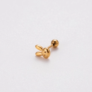 Macro view of gold rabbit stud earring with a secure screw back ball closure