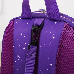 Close-up of purple rocket backpack showing durable mesh fabric and black safety buckle