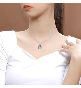 Close-up of 925 sterling silver necklace featuring a colorful rainbow gemstone pendant