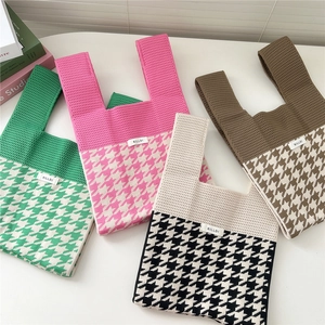 Chic houndstooth knitted tote bags in four colors shown from a top-down flat lay view