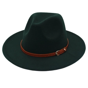 Close-up of a dark green fedora hat featuring a brown leather band and gold buckle