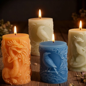 Embossed dragon and raven cylindrical candles in orange, white, blue and green colors