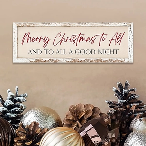Detail of wooden Merry Christmas sign with pine cones and festive ornaments