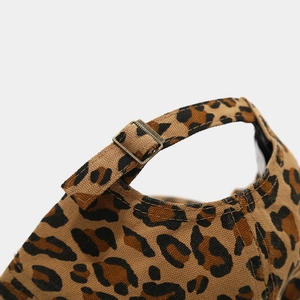 Close-up of vintage leopard print baseball cap with adjustable metal buckle detail