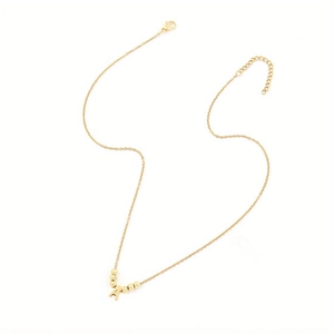 Detail of gold letter A pendant necklace with polished beads and lobster clasp closure