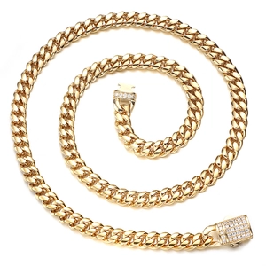 Close-up of golden Cuban link necklace with diamond-encrusted square buckle detail