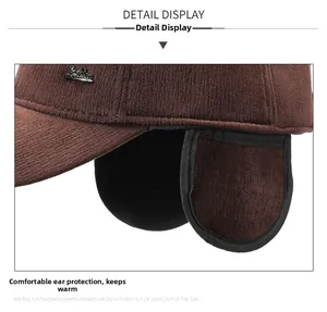 Detailed side view of dark brown winter baseball cap with ear flaps and metal logo