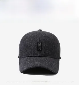 Detailed view of dark grey wool blend baseball cap with a black leather fashion patch