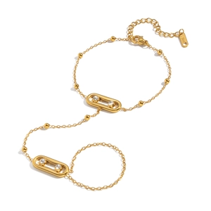 Bracelet bague en acier doré avec breloques en zircon et maillons ovales géométriques