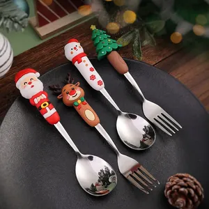 Set posate natalizie da 4 pezzi in acciaio inox con simpatici manici a forma di Babbo Natale