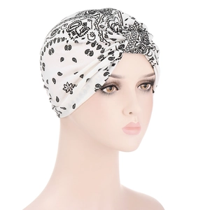 Detail of black and white paisley cotton headwrap showing fabric texture and ethnic pattern