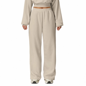Women high waisted straight leg sweatpants and hoodie set in beige fleece material