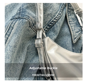 Detail view of adjustable silver buckle on metallic leather shoulder bag strap