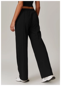 Detail view of high waist wide leg sweatpants with vertical stitched front seam and black finish