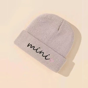 Kids purple knit beanie with mini embroidery and heart pattern for winter warmth