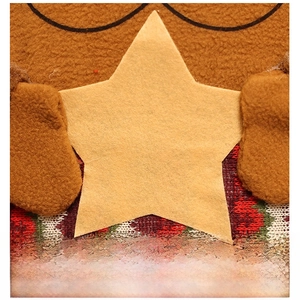 Detail of Christmas chair cover showing felt star patch and brown fleece texture