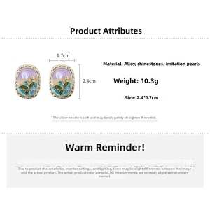 Detail view of vintage enamel flower earrings with pearls and rhinestones size 2.4x1.7cm