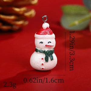 Detailed dimensions and 2.3g weight of a resin snowman pendant with glitter finish