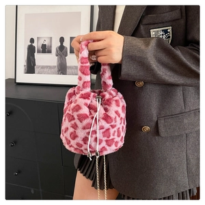Pink plush faux fur leopard print bucket bag with drawstring closure and metal chain strap