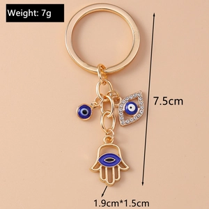 Detailed view of Hamsa Hand and Evil Eye keychain with dimensions and weight specs