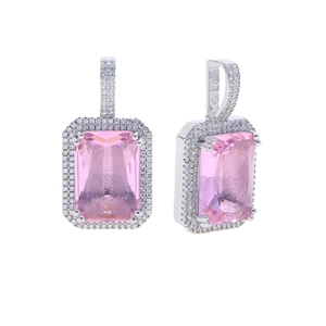 Macro view of pink emerald-cut gemstone pendant with halo setting and silver metal detail