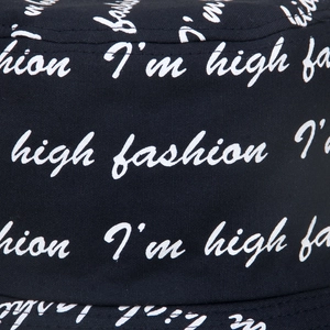 Close-up of black cotton bucket hat with white I'm high fashion letter print detail