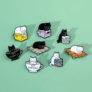 Set of 8 cute cat enamel pins showing kittens in rice cookers and books on green background