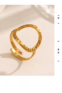 Close-up of golden stainless steel ring featuring organic hammered texture details