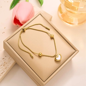 Elegant gold heart pendant necklace with white shell inlay and adjustable slider chain link