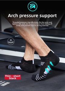 Close-up of black athletic running socks with white compression arch support on a treadmill
