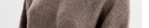 Close-up of brown knit beanie showing soft plush fabric texture and quality detail