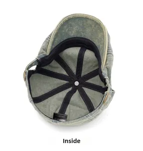 Detail of vintage washed denim beret featuring 100% cotton material and inner stitching