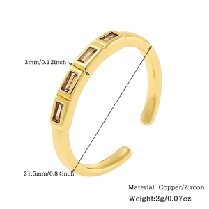 Detail showing 18K gold-plated ring with three brown rectangular zircons and size specs