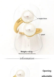 Detail view of adjustable gold-finish ring with two 10mm pearls on white background