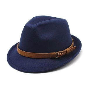 Detail of navy blue wool fedora hat crown and brown leather band with metal buckle