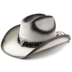 Western straw cowboy hat with ethnic band and silver bull head charm on white background