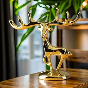 Close-up of golden reindeer ornament showing detailed antlers and luxury metallic finish
